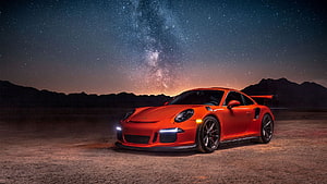 Orange Porsche 911 GT3 RS Under Starry Night Sky With Milky Way HD wallpaper