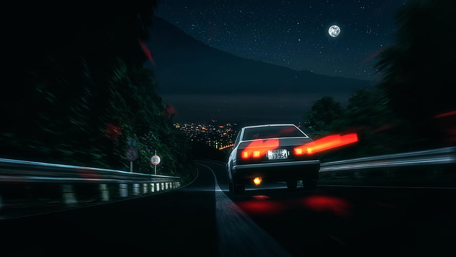 Night Drive on Mountain Road with City Lights and Moon HD wallpaper