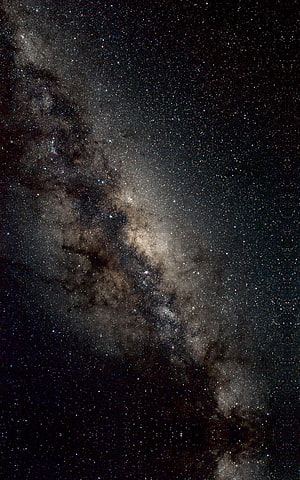 Milky Way Galaxy Core with Dense Star Fields and Dark Dust Lanes in Deep Space HD phone wallpaper