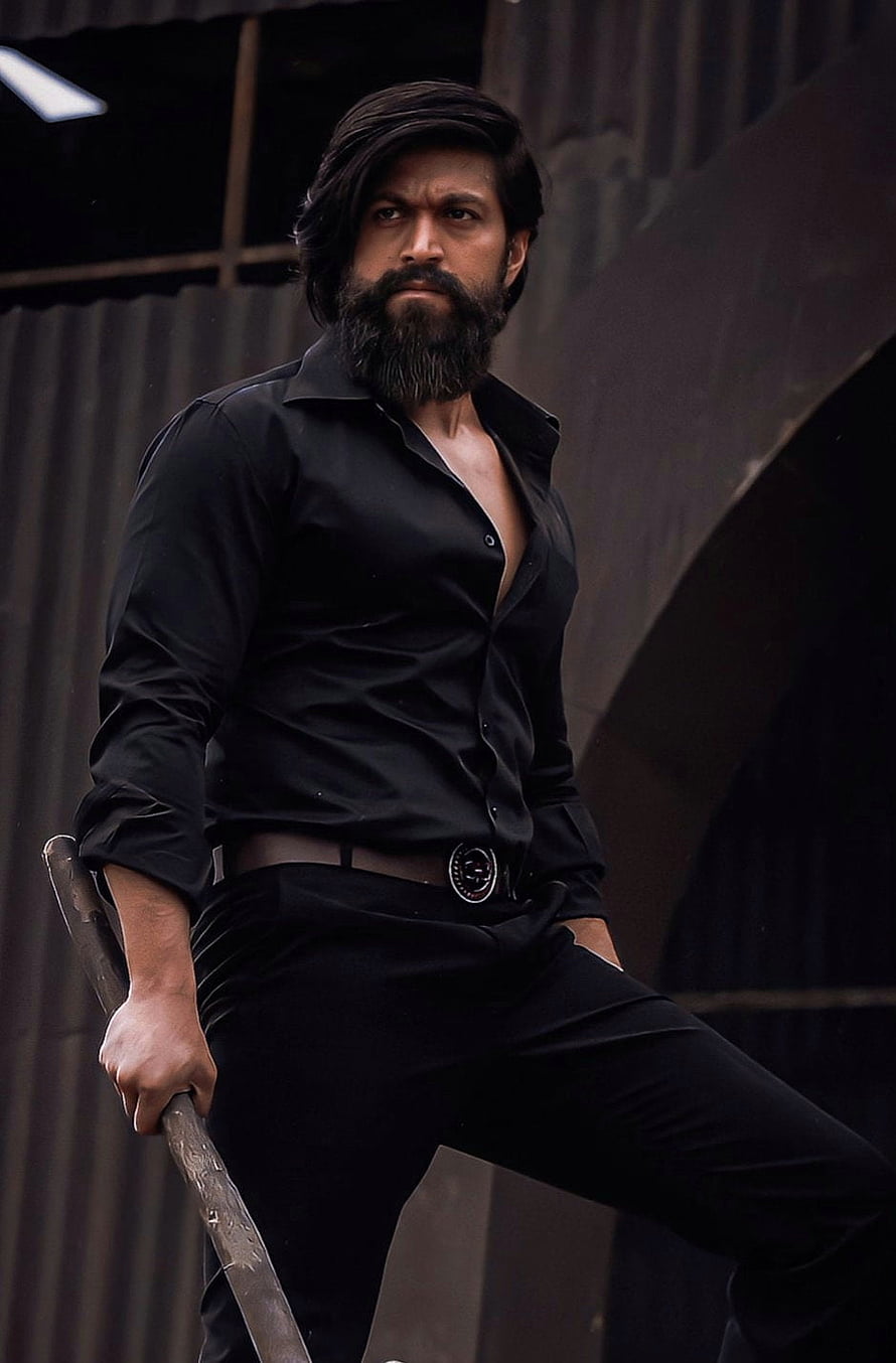 Allu Arjun in Black Shirt and Pants Holding a Stick HD phone wallpaper