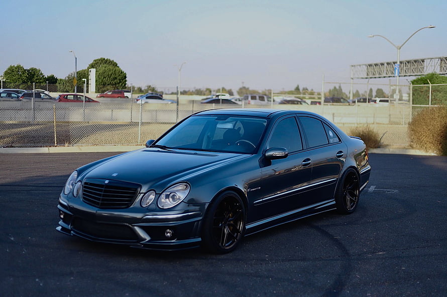 Black Mercedes-Benz W211 E55 AMG Sedan with Custom Black Alloy Wheels HD wallpaper