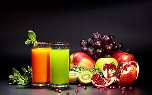 Fresh Fruit Juice and Assorted Produce Arrangement on Dark Background HD wallpaper