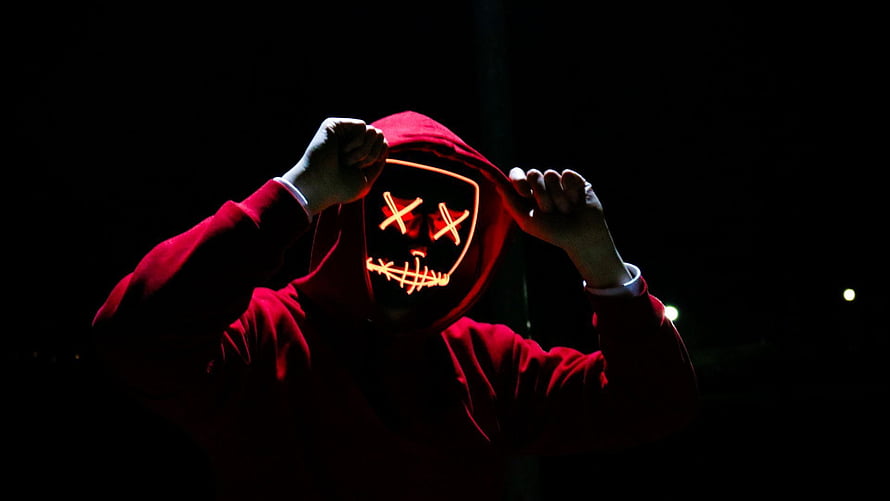 Person in Red Hoodie Wearing Glowing LED Mask with X Eyes and Stitched Mouth HD wallpaper