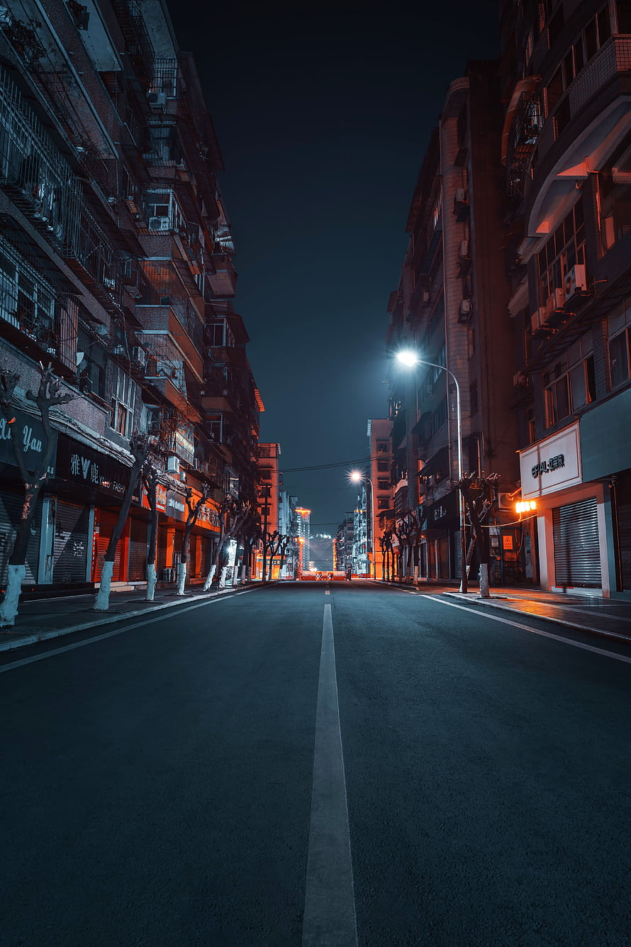 Moody Nighttime Urban Street Scene With Neon Lights And Empty Road HD phone wallpaper