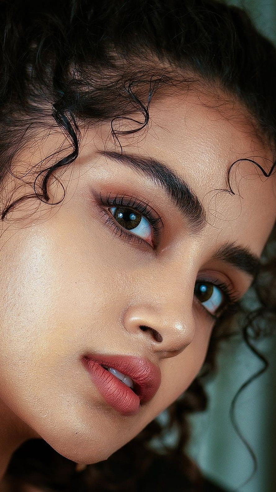 Close-up portrait of a woman with curly hair and striking eyes, Anupama parameshwara, nose, lip HD phone wallpaper