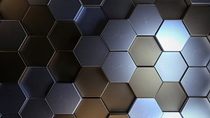 Dark metallic hexagonal tile pattern with reflective light highlights and industrial texture HD wallpaper