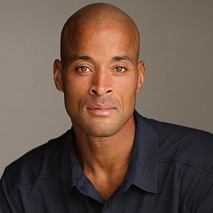 David Goggins Studio Portrait in Navy Shirt Against Neutral Gray Background HD phone wallpaper