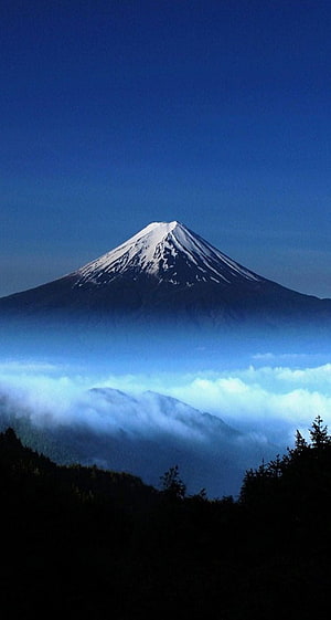 Snow-Capped Mount Fuji Rising Above a Sea of Clouds in Japan HD phone wallpaper