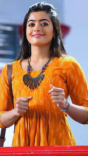Rashmika Mandanna in Vibrant Orange Traditional Dress with Statement Necklace HD phone wallpaper
