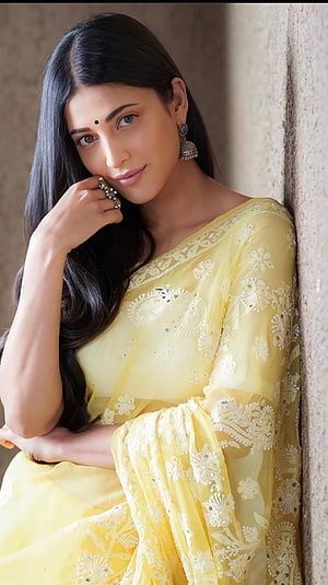 Rashmika Mandanna in a Yellow Saree Portrait, Shruthi hassan, shruti hassan, telugu actress, saree beauty HD phone wallpaper
