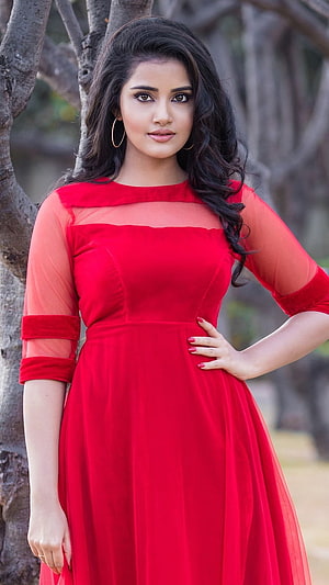 Woman in Elegant Red Dress with Sheer Sleeves Standing Outdoors, Anupama Parameswaran, Anupama Parameswaran Heroine HD phone wallpaper