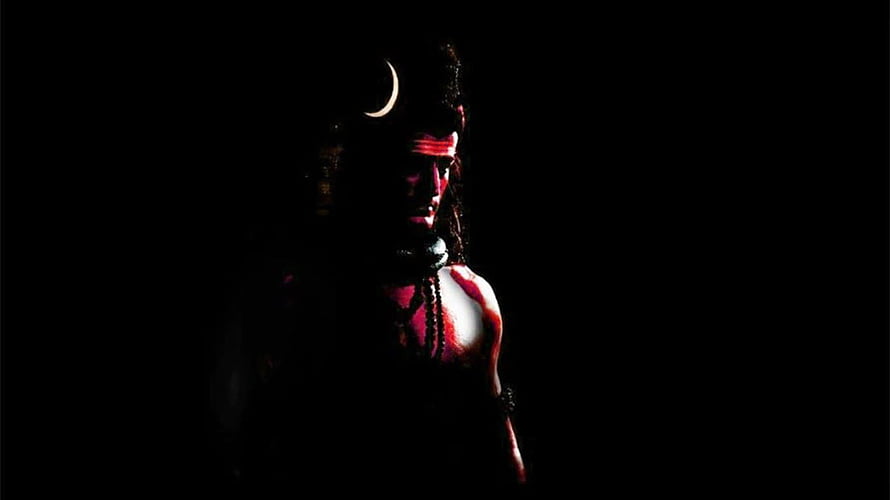 Lord Shiva Mahadev with Crescent Moon and Rudraksha Beads in Dramatic Shadow HD wallpaper