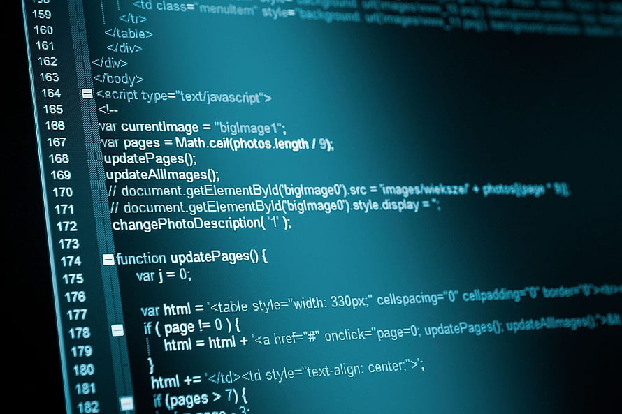 Close-up of computer programming code on a monitor screen with blue background HD wallpaper