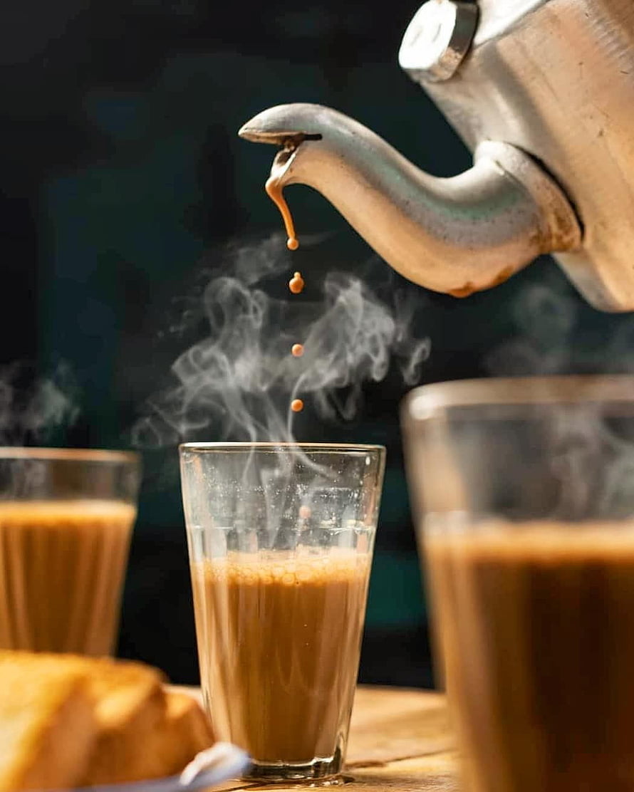 Hot Tea Pouring From Vintage Metal Teapot Into Glass Cup With Steam HD phone wallpaper