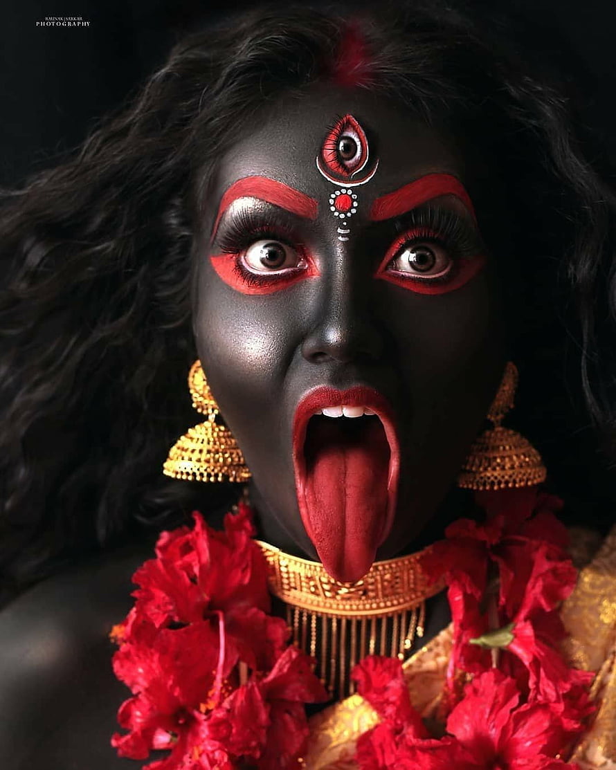 Kali Mata Portrait with Black Face Paint, Red Makeup, and Golden Jewelry HD phone wallpaper