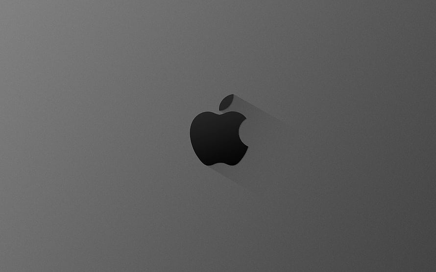 Minimalist Apple Logo on Dark Gray Surface with Soft Shadow HD wallpaper