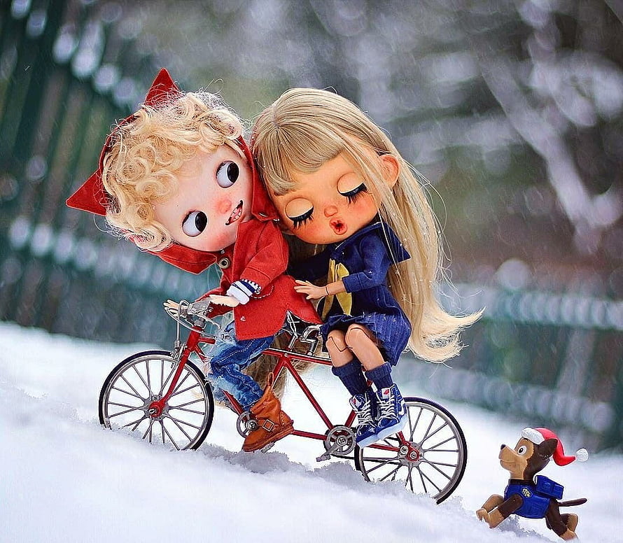 Cute Doll Couple Riding a Red Bicycle in the Snow with a Small Dog HD wallpaper