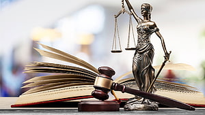 Lady Justice Statue with Gavel and Open Book Symbolizing Law and Order HD wallpaper