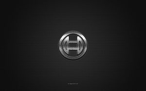 Sleek Metallic H Emblem on Dark Carbon Fiber Background HD wallpaper