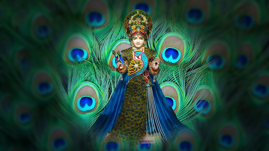 Swaminarayan Bhagwan in ornate peacock feather attire with radiant blue and green backdrop HD wallpaper