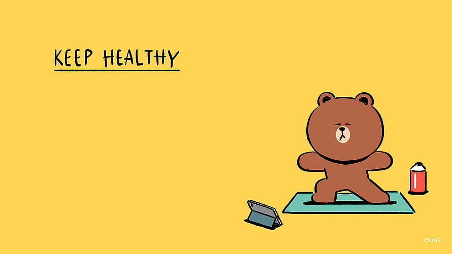 Brown Bear Doing Yoga on a Mat with Tablet and Water Bottle on Yellow Background HD wallpaper