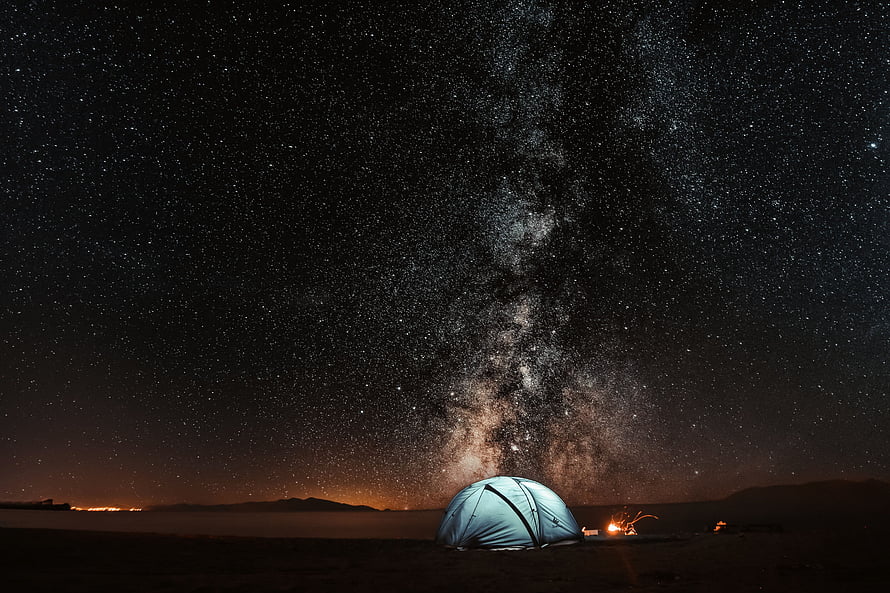 Camping Under The Milky Way Galaxy With Glowing Tent And Campfire HD wallpaper