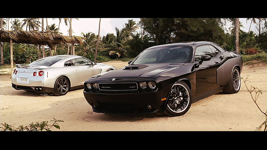 Dodge Challenger SRT and Nissan GT-R parked on a tropical beach with palm trees HD wallpaper
