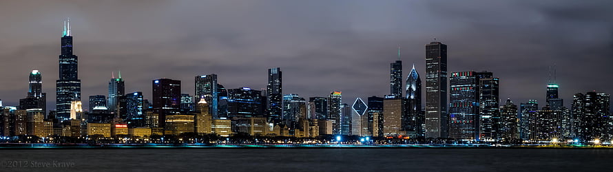 Chicago Skyline at Night with Lakefront Reflections and Illuminated Skyscrapers HD wallpaper