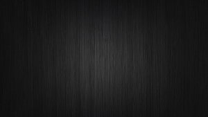 Dark Textured Background with Subtle Vertical Grain and Soft Center Glow HD wallpaper