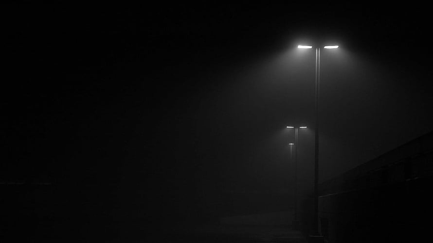 Minimalist street lamps glowing through thick fog on a dark night HD wallpaper
