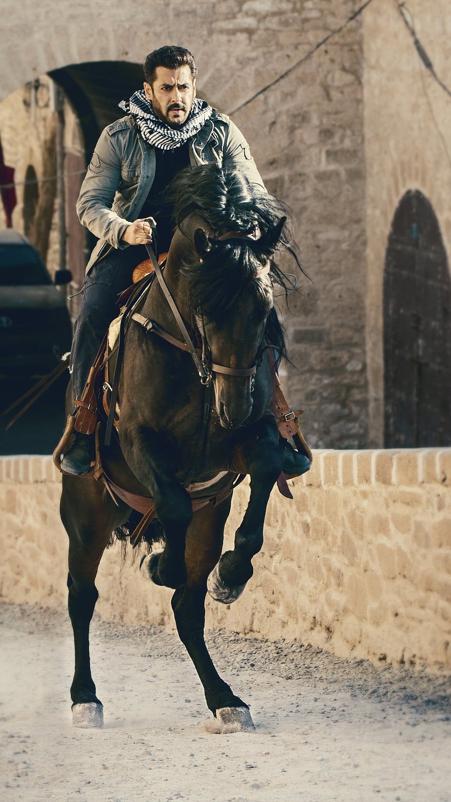 Salman Khan riding a dark horse through a stone alley in Tiger Zinda Hai, Tiger Zinda hai, horse, Salman_Khan HD phone wallpaper