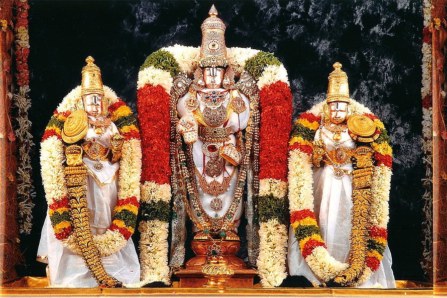 Traditional Hindu Deities Adorned with Gold Jewelry and Flower Garlands HD wallpaper