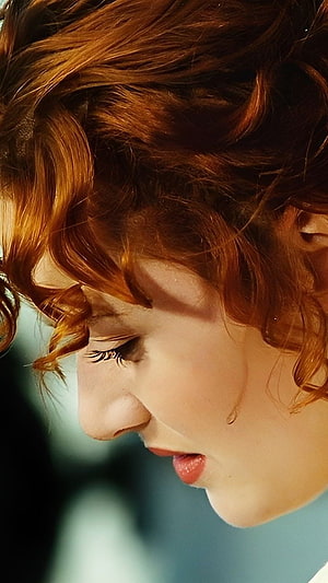 Kate Winslet Profile Portrait with Curly Red Hair and Soft Cinematic Lighting HD phone wallpaper