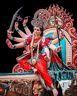 Goddess Durga Statue with Multiple Arms Holding Weapons and Trishul on Lion HD phone wallpaper