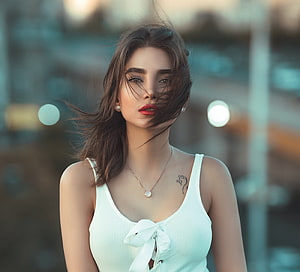 Portrait of a woman with windblown hair wearing a white top and red lipstick, Beautiful woman, brunette, white top HD wallpaper