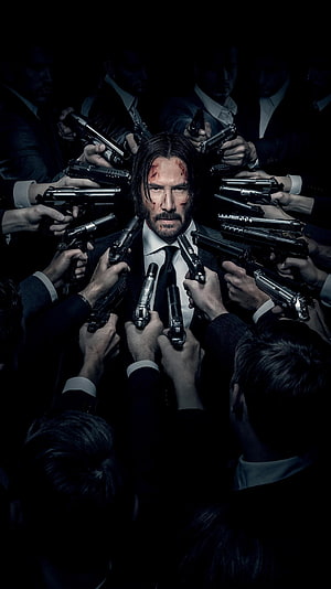 John Wick Surrounded by Guns in Dark Suit Action Scene HD phone wallpaper