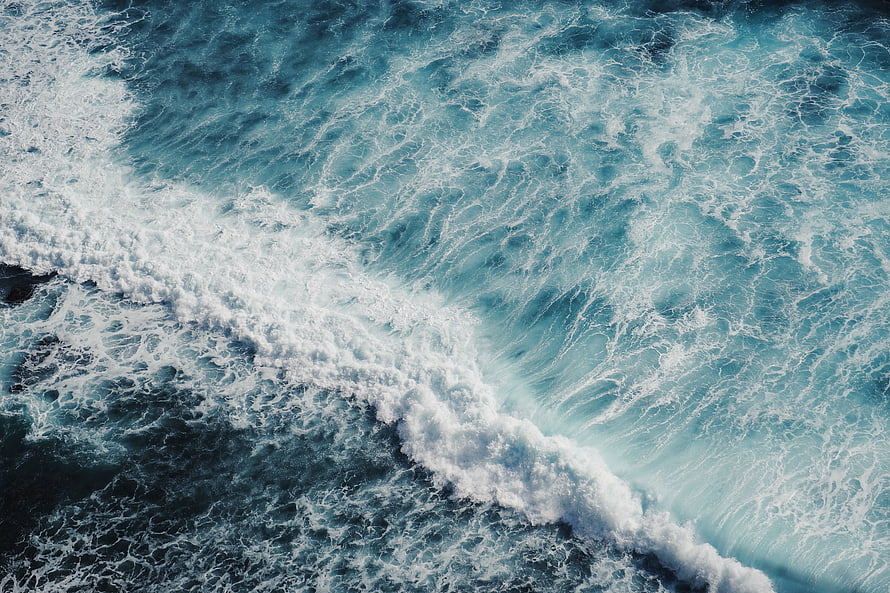 Aerial View of Turquoise Ocean Waves and White Sea Foam HD wallpaper