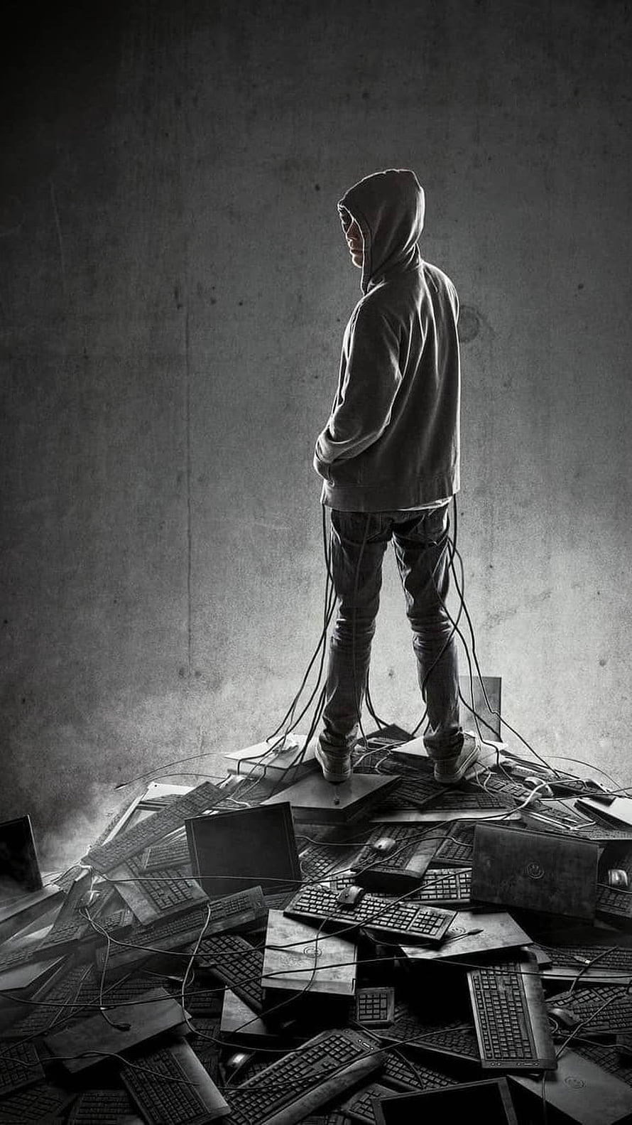 Hacker in Hoodie Standing on Pile of Broken Computers and Keyboards HD phone wallpaper