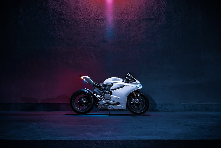 White Ducati Panigale 1199S Superbike in Moody Neon Studio Lighting HD wallpaper